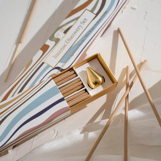The natural incense discovery set is placed flat on a white background with incense sticks placed in a messy manner.