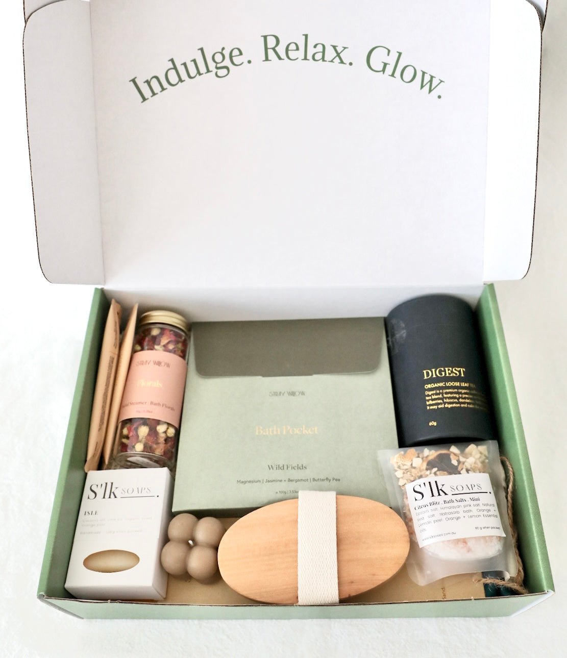 Cosmetics and wellness products packed in a wellness gift box.