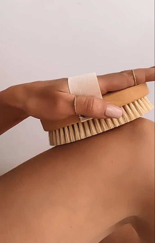 Natural Dry Body Brush being used on a persons skin