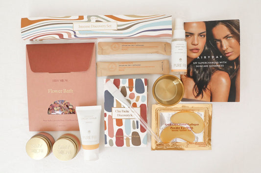 A flat layout of the self-care box filled with luxury cosmetics,